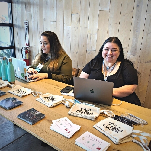 Deb de Freitas checks people in at a Austin Together Digital event
