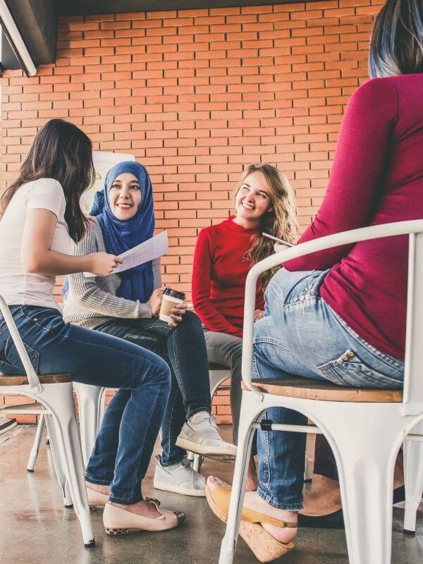 Women chat over coffee